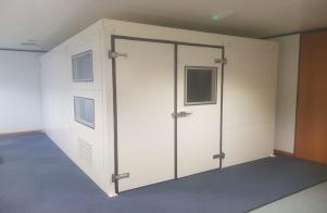 Indoor acoustic enclosure within an educational setting 